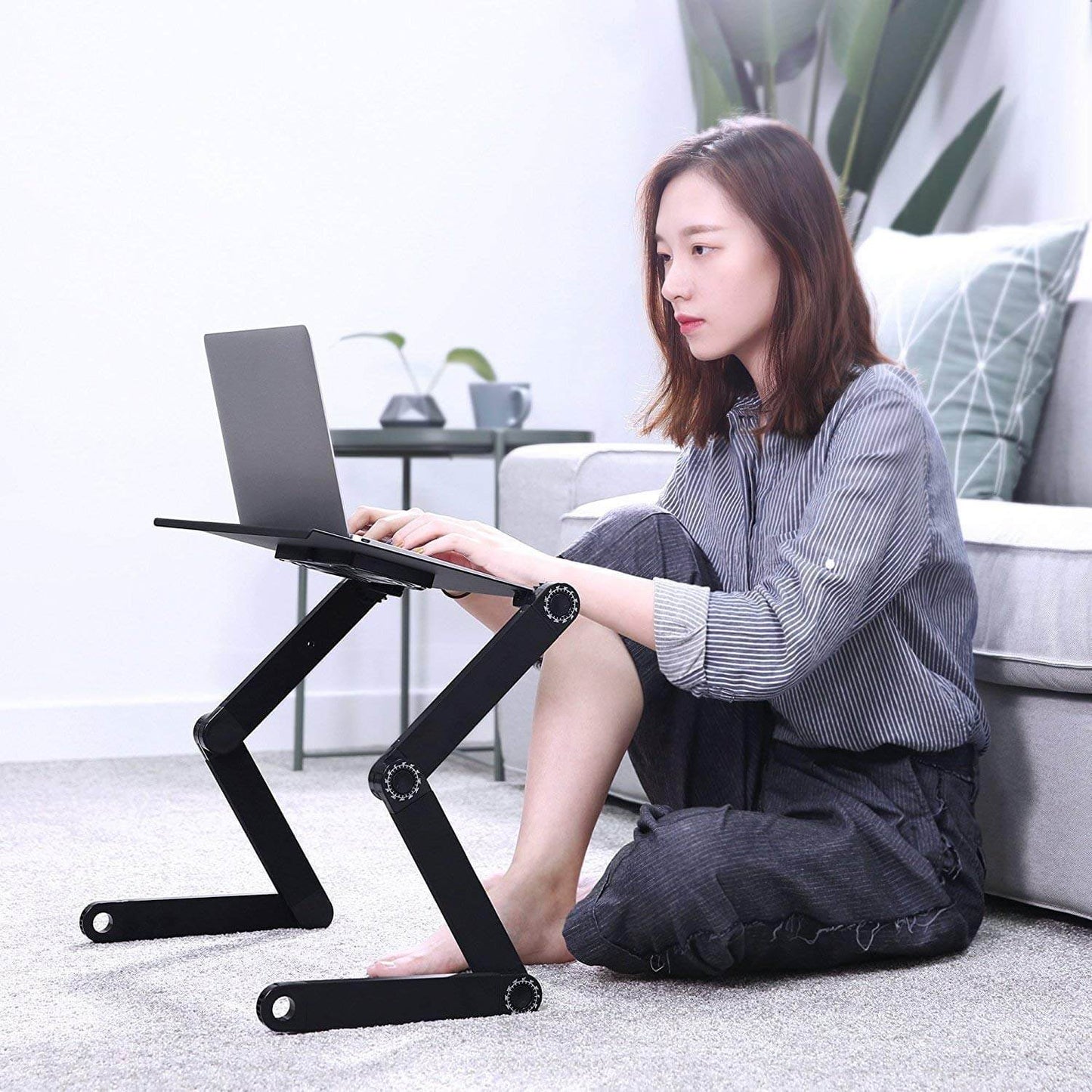 Black laptop table with blue dots
