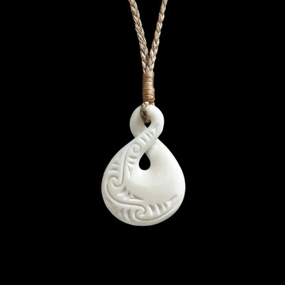 Small Carved Pikorua Twist, handcrafted bone pendant with plaited cord