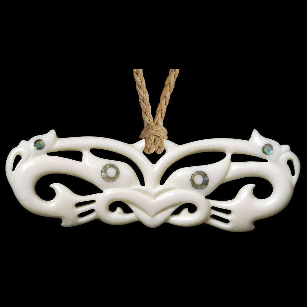 large Wheku Mask Manaia, pekapeka style bone pendant