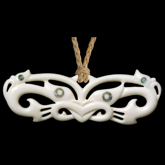 large Wheku Mask Manaia, pekapeka style bone pendant