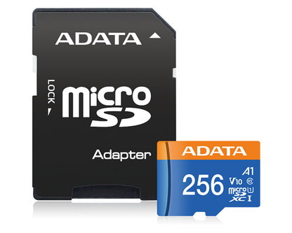 MicroSD card next to laptop