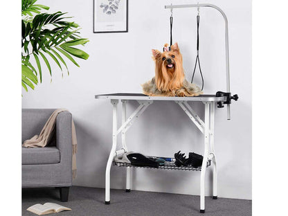 Portable pet grooming table