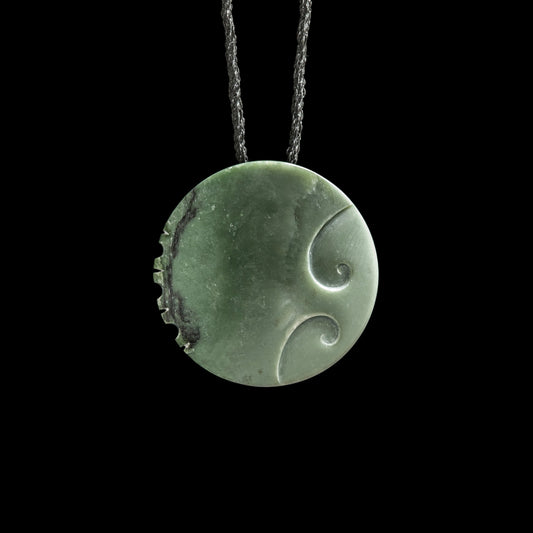 Jade disc pendant with korus by Madelyne Gourdin Necklace