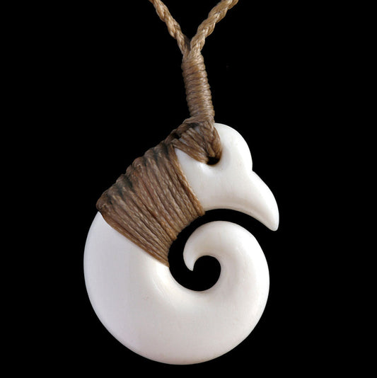 Bound Brosnan Koru, handcrafted bone pendant
